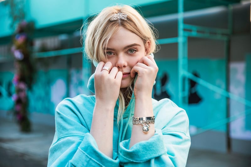 Elle Fanning stars in the campaign for Tiffany & Co's new Paper Flowers collection. Courtesy Tiffany & Co