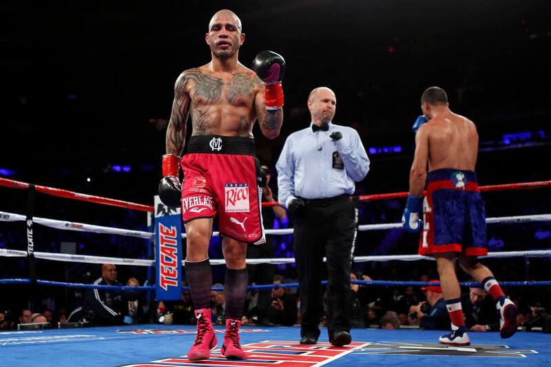 Miguel Cotto walks back to his corner after the sixth round against Sadam Ali during a WBO junior middleweight title boxing match Saturday, Dec. 2, 2017, in New York. (AP Photo/Adam Hunger)