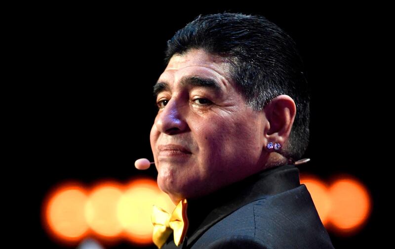 In this file picture taken on December 1, 2017 Argentina's former footballer Diego Maradona poses on stage ahead of the 2018 World Cup draw at the State Kremlin Palace in Moscow. AFP