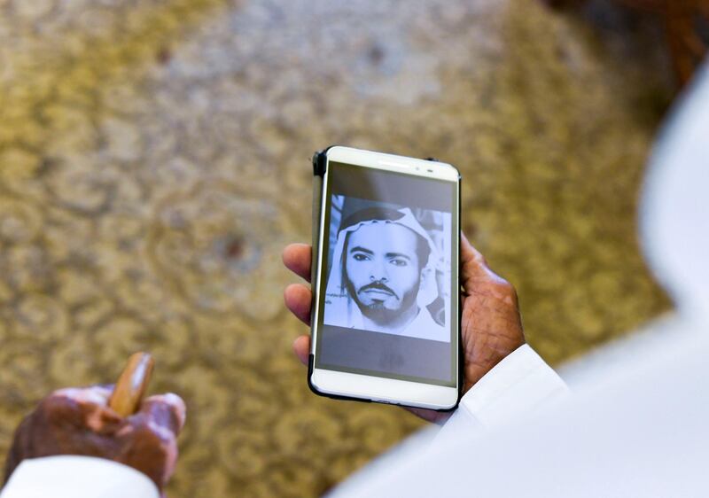 Abu Dhabi, United Arab Emirates - Buti Al Mazrouei, 80, shows a photograph of himself during his younger days, at his home in Al Ain. Khushnum Bhandari for The National