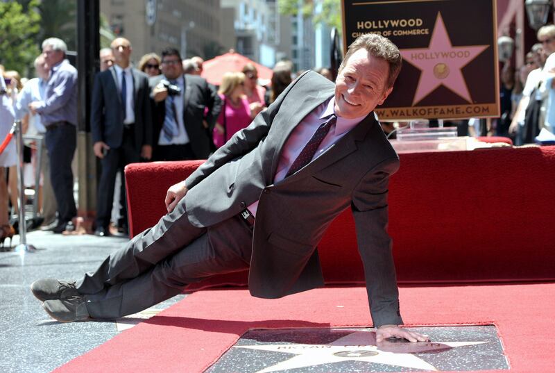 IMAGE DISTRIBUTED FOR AMC - Bryan Cranston poses on his new star on the Hollywood Walk of Fame on Tuesday, July 16, 2013 in Los Angeles. (Photo by John Shearer/Invision for AMC/AP Images) *** Local Caption ***  Bryan Cranston Receives Star on Walk of Fame.JPEG-01892.jpg