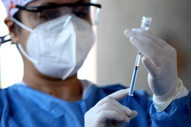 A nurse prepares a dose of the Pfizer-BioNTech vaccine against Covid-19 at the vaccination center set up at the Cabanas Institute in Guadalajara, Jalisco state, Mexico. AFP 