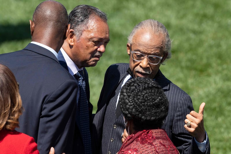 Rev Jesse Jackson and civil rights leader Al Sharpton arrive at the event. AFP