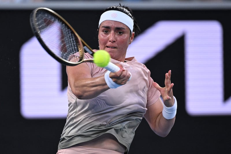 Ons Jabeur hits a forehand to Yuliia Starodubtseva during their match on day two of the Australian Open. AFP