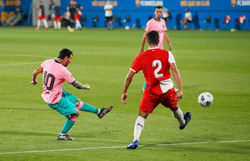 Lionel Messi scores Barca's third goal. Reuters