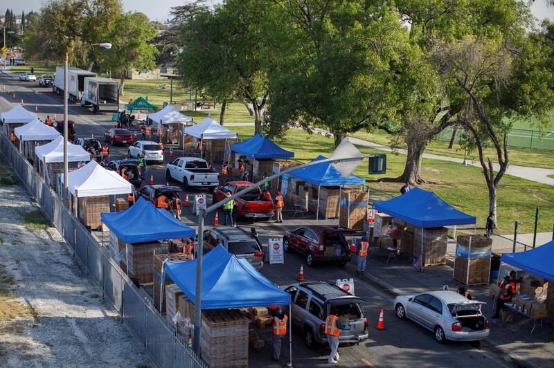 The Los Angeles Regional Food Bank programme Let's Feed LA County distributes food to needy families at Franklin D Roosevelt Park during the outbreak of the coronavirus disease in Los Angeles, California. Reuters