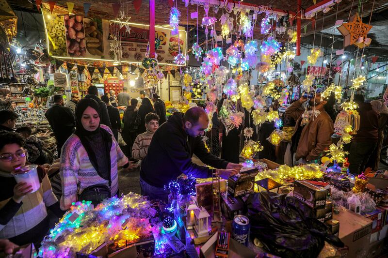 A Palestinian man sells traditional Ramadan lanterns, called fanous, in Gaza City. EPA