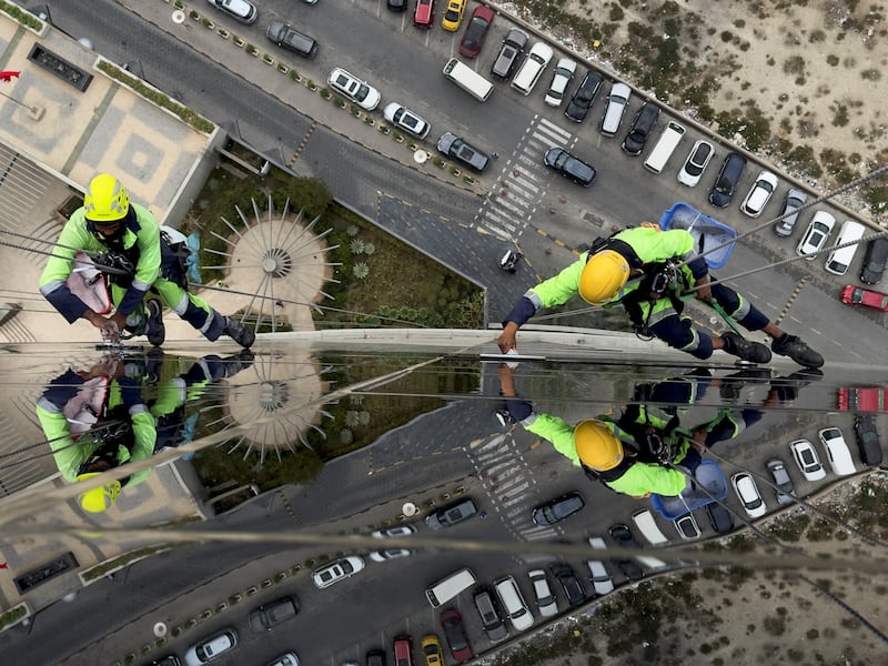 Window cleaners known as 'Spidermen' at work on a skyscraper in Manama, Bahrain. Reuters