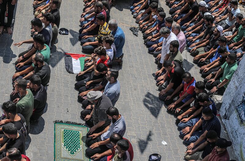 Palestinians attend the funeral of Yasser Al Nabhin and his three children at Al Bureije refugee camp in the central Gaza Strip. EPA