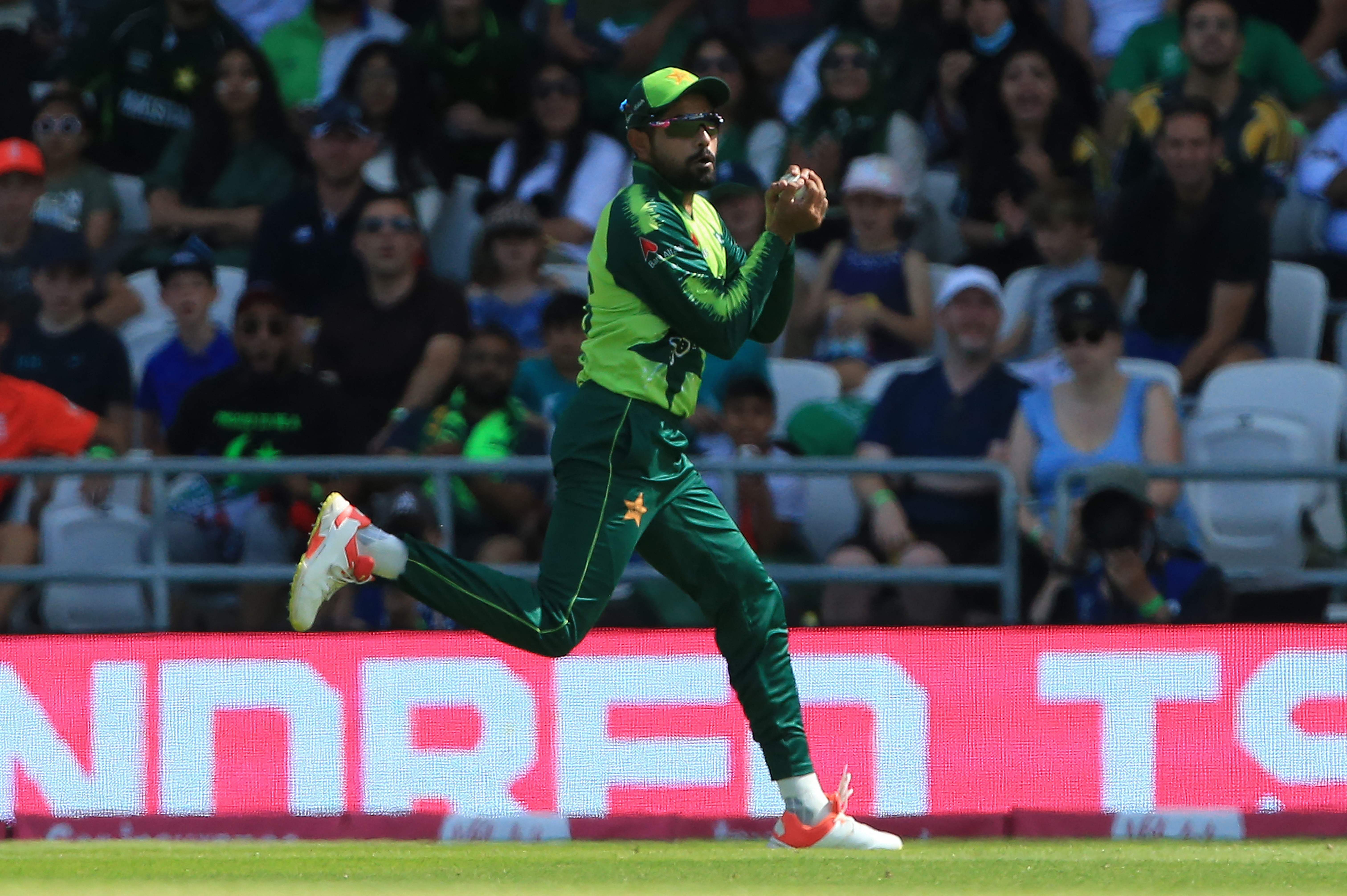 Pakistan's Babar Azam takes a catch to dismiss England's Moeen Ali.