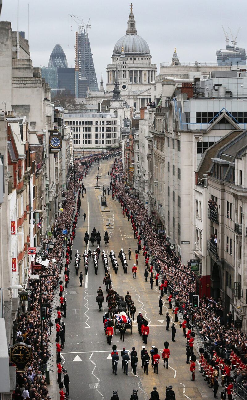 LONDON, ENGLAND - APRIL 17:  The funeral cortege carrying the body of former Prime Minister Margaret Thatcher passes along Fleet Street towards St Paul's Cathedral on April 17, 2013 in London, England. Dignitaries from around the world are today joining Queen Elizabeth II and Prince Philip, Duke of Edinburgh as the United Kingdom pays tribute to former Prime Minister Baroness Thatcher during a Ceremonial funeral with military honours at St Paul's Cathedral. Lady Thatcher, who died last week, was the first British female Prime Minister and served from 1979 to 1990.  (Photo by Peter Macdiarmid/Getty Images) *** Local Caption ***  166796151.jpg