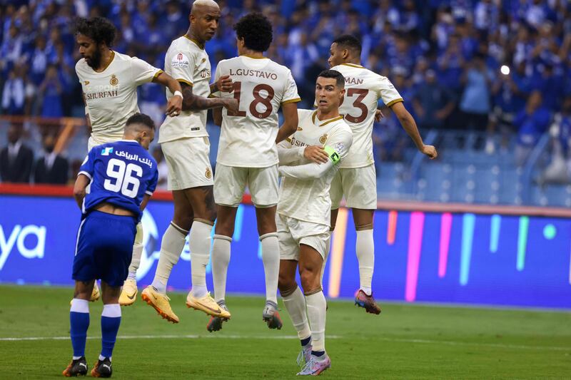 Al Nassr's Portuguese forward Cristiano Ronaldo lines up in a wall with teammates to defend an Al Hilal free kick. AFP