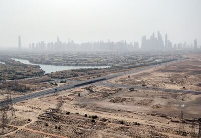Jumeirah Village Circle is generally a more affordable alternative to Dubai Marina, which lies a few kilometres to the north, as shown here. One downside is that the roads leading to JVC are often very congested. Chris Whiteoak / The National