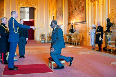 Prince William serving as a counsellor of state under Queen Elizabeth II, knighting Guyanese former cricketer Clive Lloyd during his investiture ceremony at Windsor Castle in January 2022. AP