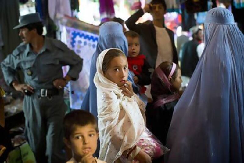 After 11 years of war, residents of southern Helmand, such as these shoppers in a bazaar in Lashkar Hag, one of the deadliest battlefields in Afghanistan, are frustrated by the lack of development and widespread insecurity despite attempts by US-led forces to stabilise the area.  Anja Niedringhaus / AP Photo