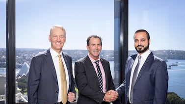 Ahmed Al Shamsi, director of energy and utilities at ADQ, right, Paul Oppenheim, founder and director of Plenary Group, left, and David Lamming, chief executive of Plenary Group. Photo: ADQ