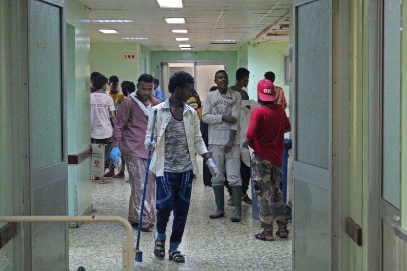 Relatives wait for news on casualties of strikes on Al Anad airbase at the Ibn Khaldun hospital in Yemen's government-held southern province of Lahij. AFP