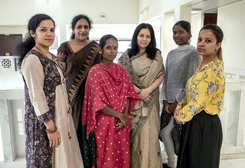 Abu Dhabi, United Arab Emirates, July 2, 2019.  This is for a runaway maids story. Veerammal Radhakishnanand ran away from an agent in Ajman and asked for help at the indian embassy.---  Embassy of India social workers helping domestic helpers in distress,  (center left) Veerammal Radhakrishnan and Lokeshwari Sudhakar. (2nd right)
Victor Besa/The National
Section:  NA
Reporter:  Ramola Talwar