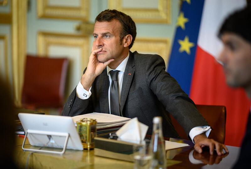 French President Emmanuel Macron attends a video European Council summit at the Elysee Palace in Paris, Friday, June 19, 2020. As they brace for the worst economic downturn since the Great Depression, leaders of the European Union's 27 member states discuss Friday the bloc's future long-term budget and a multi-billion post-coronavirus recovery plan during a video-summit aimed at paving the way for a compromise later this summer. (Eliot Blondet/Pool Photo via AP)