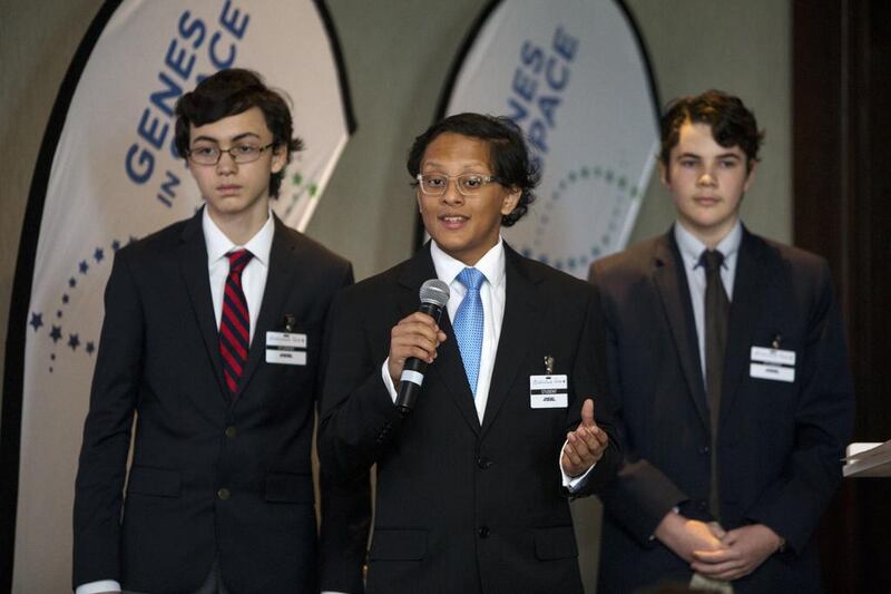 Finalists Akio Shirali, Matteo Sottocornola and Wilson Huijsmans from Cranleigh School in Abu Dhabi present their project during the finals for the Genes in Space competition. Christopher Pike / The National