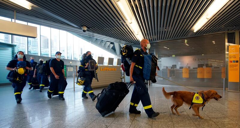 Members of German Federal Agency for Technical Relief (THW) arrive for their departure to Beirut at international airport in Frankfurt am Main, Germany.  EPA