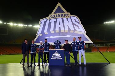 (L to R) Chief Operating Officer (COO) Gujarat Titans, Arvinder Singh, Gujarat Titans director of cricket Vikram Solanki, Chief Business Officer Ather Energy Ravneet Singh Phokela, captain Gujarat Titans Hardik Pandya, BCCI Secretary Jay Shah, Parter CVC Capital Amit Soni and head coach Gujarat Titans Ashish Nehra, pose for pictures during the unveiling of Gujarat Titans Jersey at the Narendra Modi Stadium in Motera on March 13, 2022.  (Photo by SAM PANTHAKY  /  AFP)  /  ----IMAGE RESTRICTED TO EDITORIAL USE - STRICTLY NO COMMERCIAL USE-----