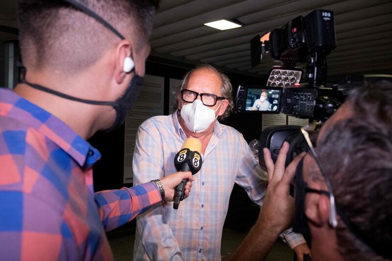 Journalists interview a Spanish tourist upon arrival at Juan Santamaria airport in San Jose, Costa Rica, on the first commercial flight since the start of the Covid-19 pandemic. EPA