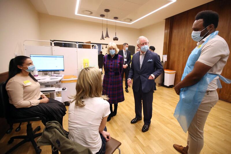Prince Charles and Camilla, Duchess of Cornwall speak to staff at the Queen Elizabeth Hospital. AFP