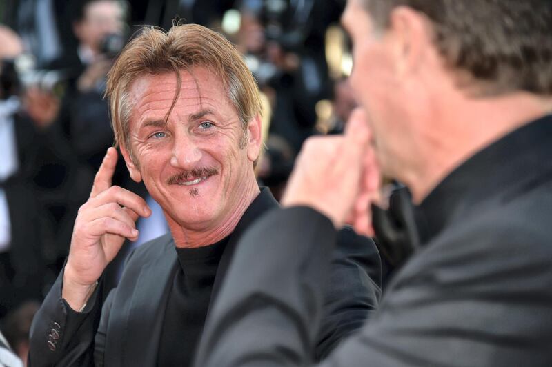 US actor and director Sean Penn jokes as he poses upon his arrival on May 20, 2016 for the screening of the film "The Last Face" at the 69th Cannes Film Festival in Cannes, southern France.  / AFP PHOTO / ALBERTO PIZZOLI