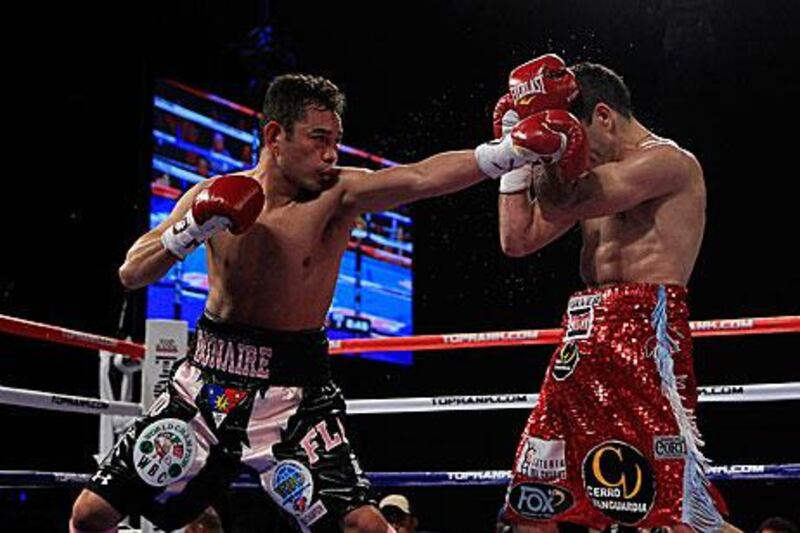 Omar Narvaez, right, kept his defences up against the champion Nonito Donaire, who was 'bored' with his challengers defensive tactics.
