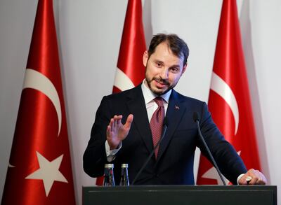 Berat Albayrak, Turkey's Finance and Treasury Minister, son-in-law of President Recep Tayyip Erdogan, speaks about a " new economic model " in Istanbul, Friday, Aug. 10, 2018. Turkey was hit by a financial shockwave Friday as its currency nosedived on concerns about its economic policies and a dispute with the U.S., which President Donald Trump stoked further with a promise to double tariffs on the NATO ally. The lira hit a record low of 6.81 per dollar on Friday, before recovering to 6.51, tumbling more than 10 percent on the day. (AP Photo/Mucahit Yapici)
