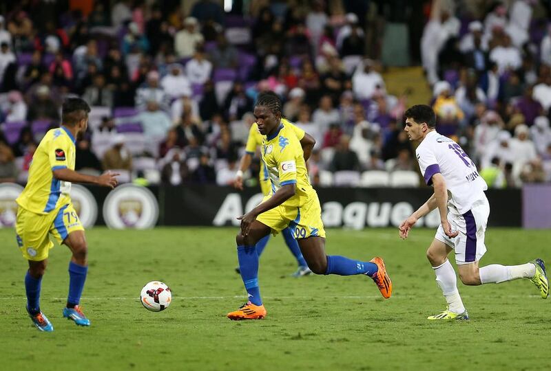 Makhete Diop, centre, of Al Dhafra spoiled Al Ain’s party at Hazza Bin Zayed Stadium with a late equaliser in the teams’ 1-1 draw on Friday. Pawan Singh / The National