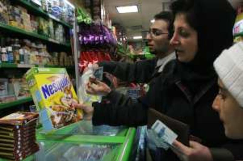 Customers buying Nestle products in a shop in Tehran. No-Nestle campaign groups have demanded a ban on Nestle products in Iran. *** Local Caption ***  03.jpg