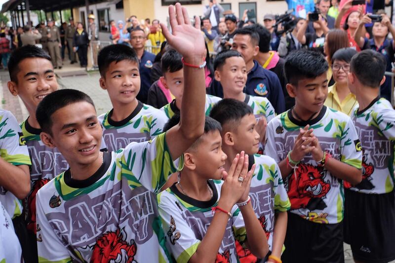 The Thai boys arrive for a press conference shortly after being discharged from hospital.  Getty Images