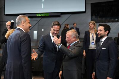 Nato chief Mark Rutte introduces Jordan's King Abdullah to alliance foreign ministers including Turkey's Hakan Fidan, left. AP