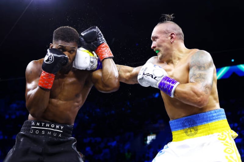 Oleksandr Usyk lands a right on Anthony Joshua. Getty