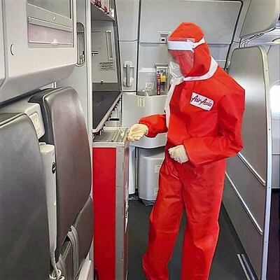 The designer PPE suits have a hood, mask and visor and were introduced on a repatriation flight from Bangkok to Manila. Courtesy Air Asia 