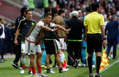 Mexico players protest a VAR decision.
