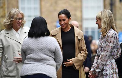 Meghan, the Duchess of Sussex, centre, is welcomed by Lady Juliet Hughes-Hallett, chair of Smart Works, and Kate Stephens, Smart Works' CEO, as she visits Smart Works charity career centre in West London, Thursday Jan. 10, 2019.  Meghan on Thursday has become patron of the Smart Works charity which supports unemployed women to return to work. (Clodagh Kilcoyne/Pool via AP)