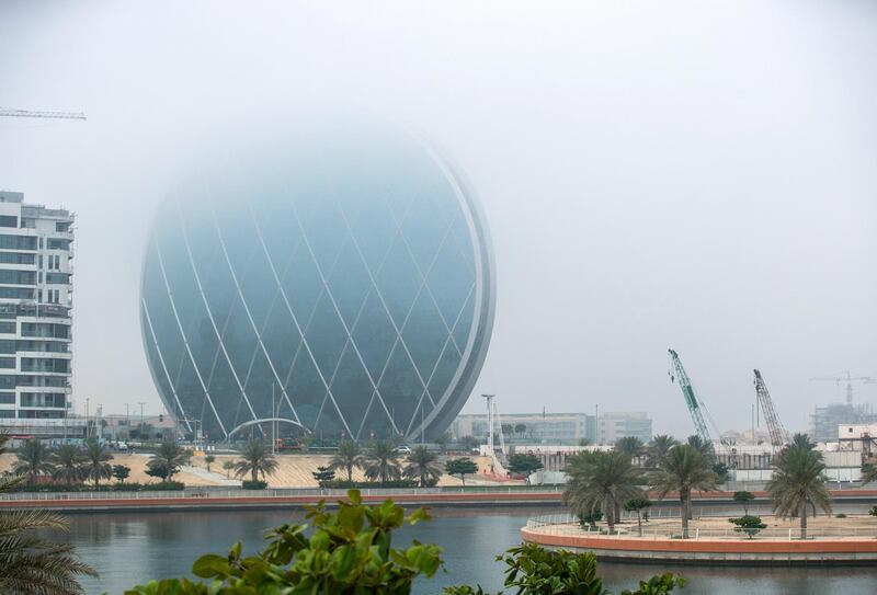 Abu Dhabi, United Arab Emirates, April 8, 2021.  Fog engulfs the Aldar HQ Building at the Al Raha Beach area.
Victor Besa/The National
Section:  AC