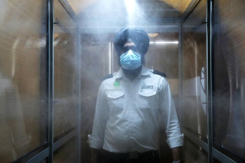 DUBAI, UNITED ARAB EMIRATES , June 30 – 2020 :- Human sanitizing tunnel installed for the visitors as a preventive measure against the spread of the coronavirus at the Gurunanak Darbar in Jebel Ali in Dubai. Places of worship opening up tomorrow in the UAE. (Pawan Singh / The National) For News. Story by Ramola