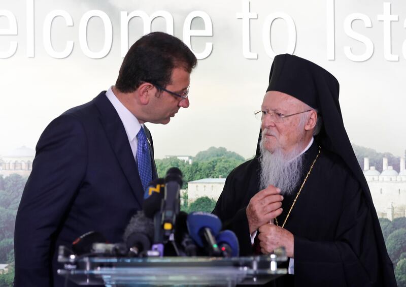 Ekrem Imamoglu, left, the newly elected Mayor of Istanbul, talks to Ecumenical Patriarch Bartholomew I, right, the spiritual leader of world's Orthodox Christians, following their meeting in Istanbul. AP