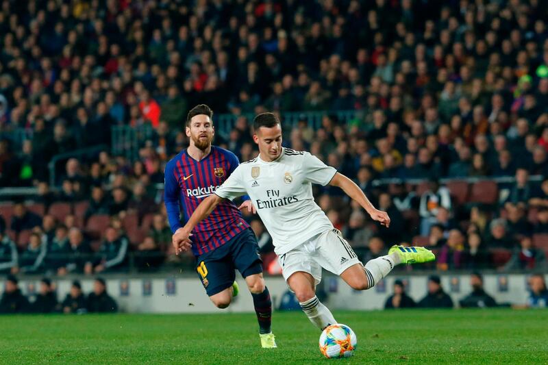 Barcelona's Lionel Messi, left, chases Real Madrid goalscorer Lucas Vazquez. AFP