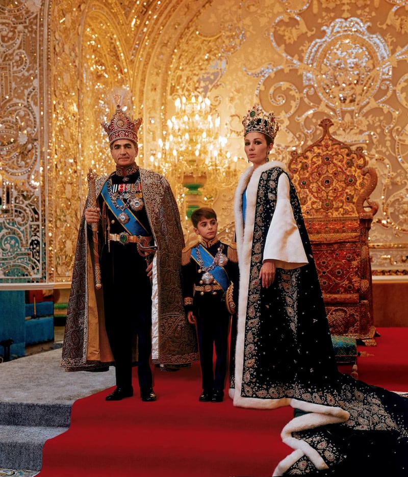 The Shah and his family in ceremonial dress in front of throne. Getty Images