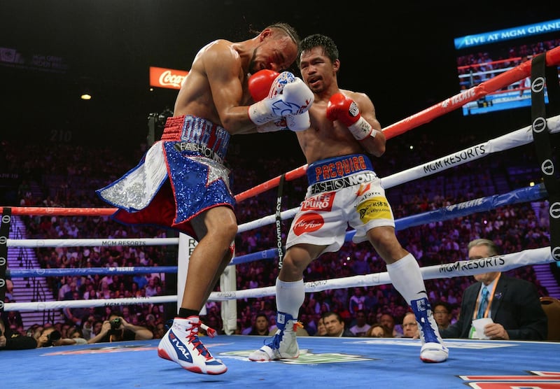 Manny Pacquiao lands a shot against Keith Thurman during their WBA welterweight bout at MGM Grand Garden Arena. Reuters