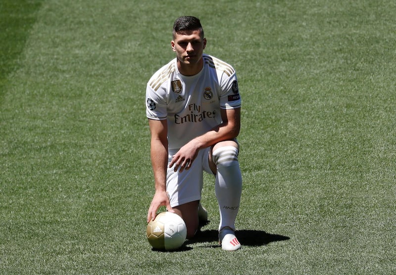 Luka Jovic poses in his Real Madrid kit following his arrival at the club. Reuters
