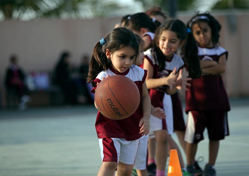 Saudi and expatriate girls practice basketball at a private sports club in Jeddah, Saudi Arabia. Hasan Jamali / AP
