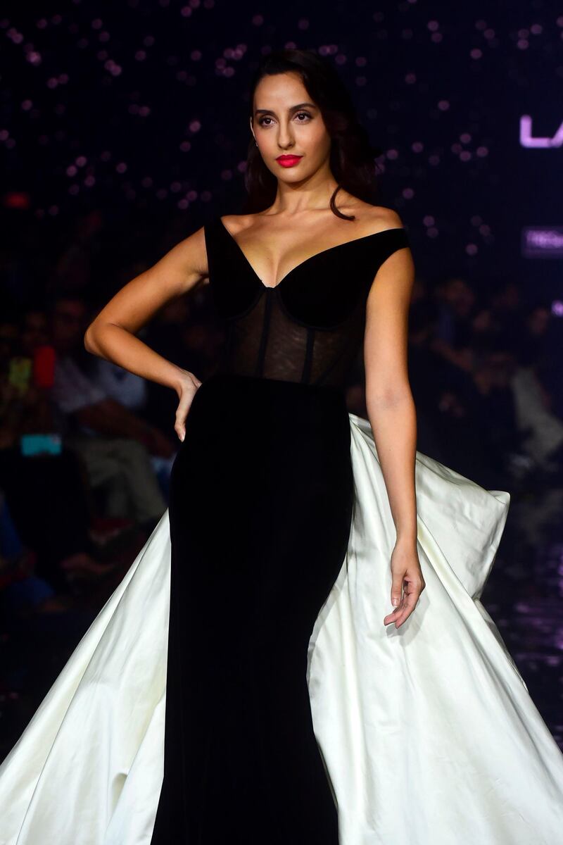 Nora Fatehi showcases a creation by designer Gauri and Nainika during Lakme Fashion Week in Mumbai. AFP