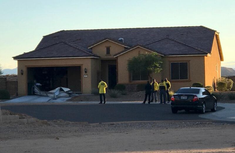 Police personnel stand outside the home of Stephen Paddock on Monday, October 2, 2017, in Mesquite. Police identified Paddock as the gunman at a music festival on Sunday evening. Mesquite Police via AP