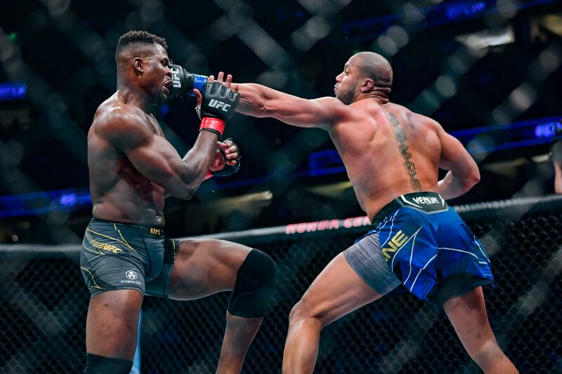 Ciryl Gane lands a jab on Francis Ngannou during their heavyweight title bout at UFC 270. USA TODAY Sports